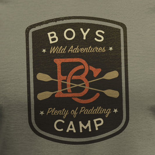 Vintage-style 'Boys Wild Adventures Camp' logo on a green background